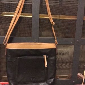 Purse by Margot leather Black and Tan with shoulder strap adjustable.
